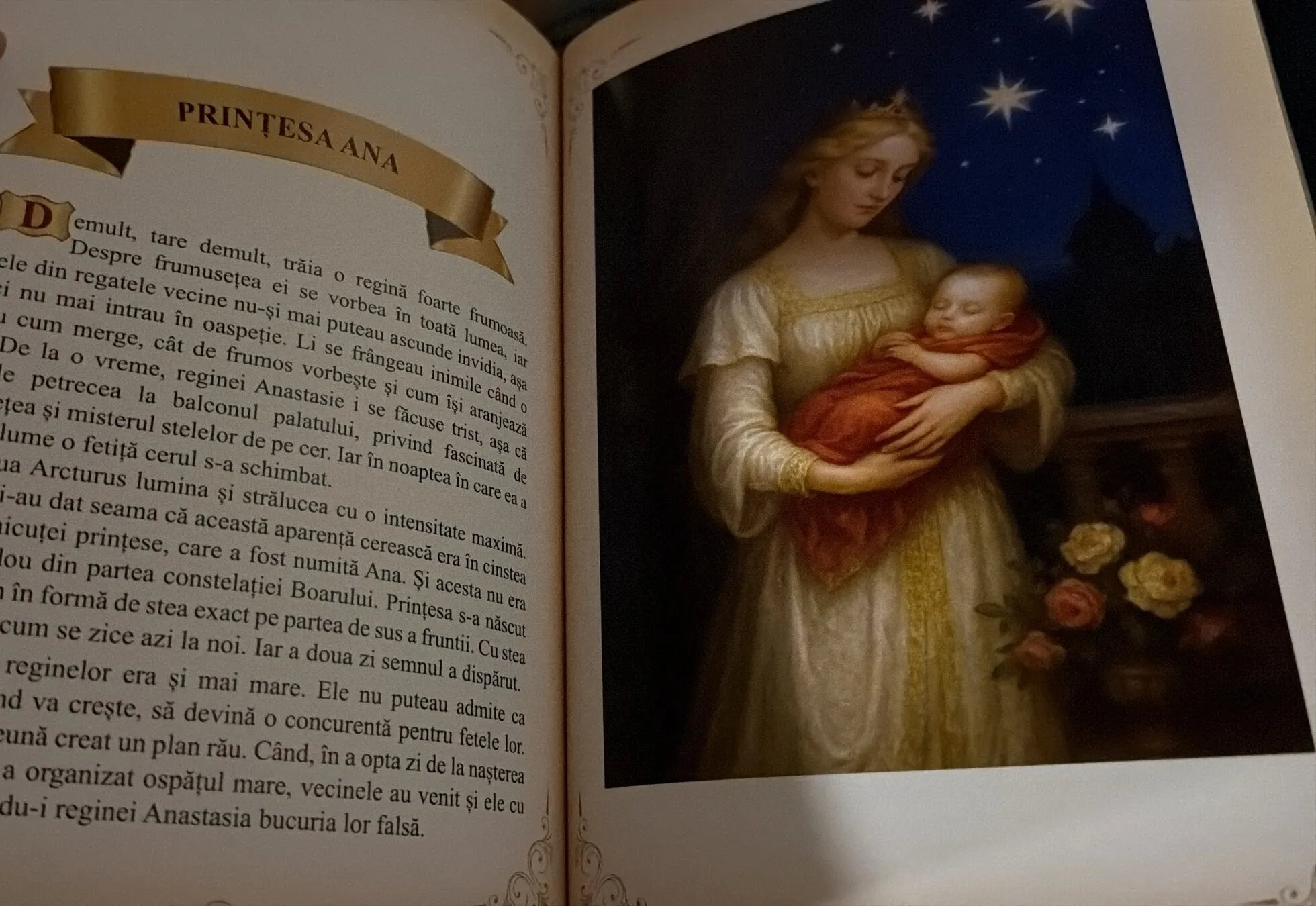 Prințesa Ana: an open page with a queen holding a baby under the stars