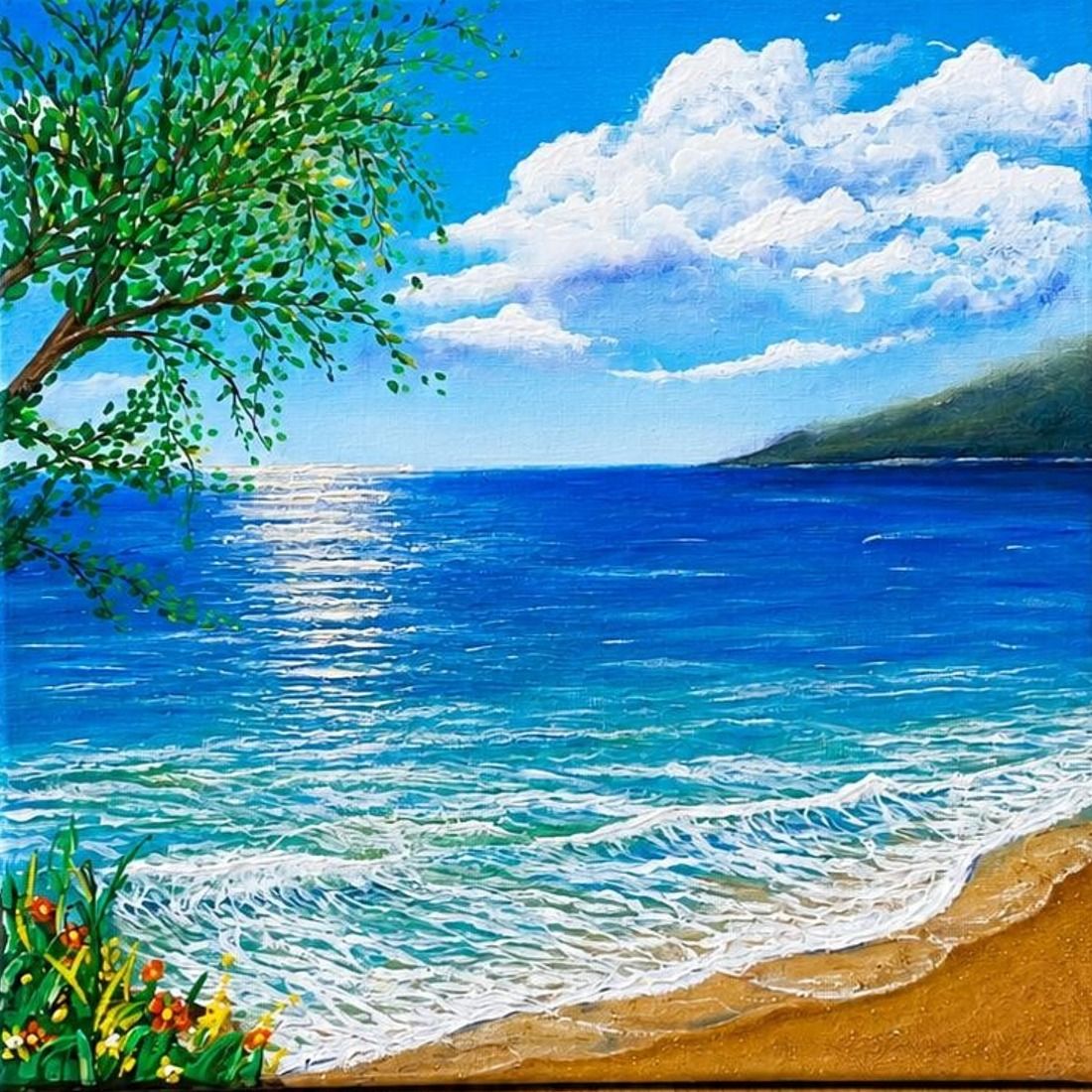 A sunlit bay with turquoise water, white surf on golden sand, a leafy branch in the corner and tall white clouds.